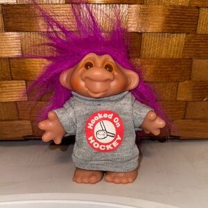 Vintage 1986 DAM 4.5” Troll Doll Purple hair “Hooked on hockey” shirt